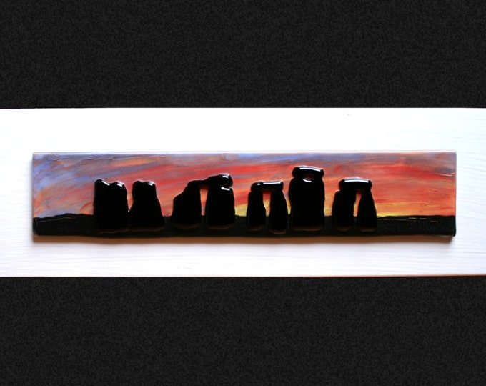 Stonehenge Sunset #1 Fused glass 'painting' raised 'stones' on a hand painted sunset background, set on a white frame. 34 x 10cm (13.5 x 4")