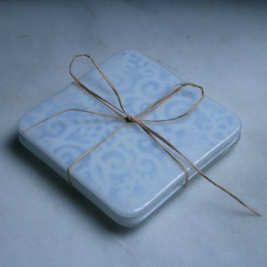 Fused glass. &#39;Jack Frost&#39;  White snowflakes on pale blue. Ski chalet coasters. Winter holiday coasters. Christmas coasters. Choose 2 or 4.