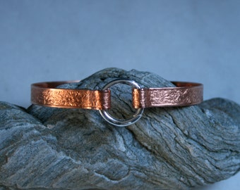 Copper BDSM cuff bracelet. Patterned copper band  with sterling silver captive 'O' ring closure. Choose pattern. Can be engraved :-)