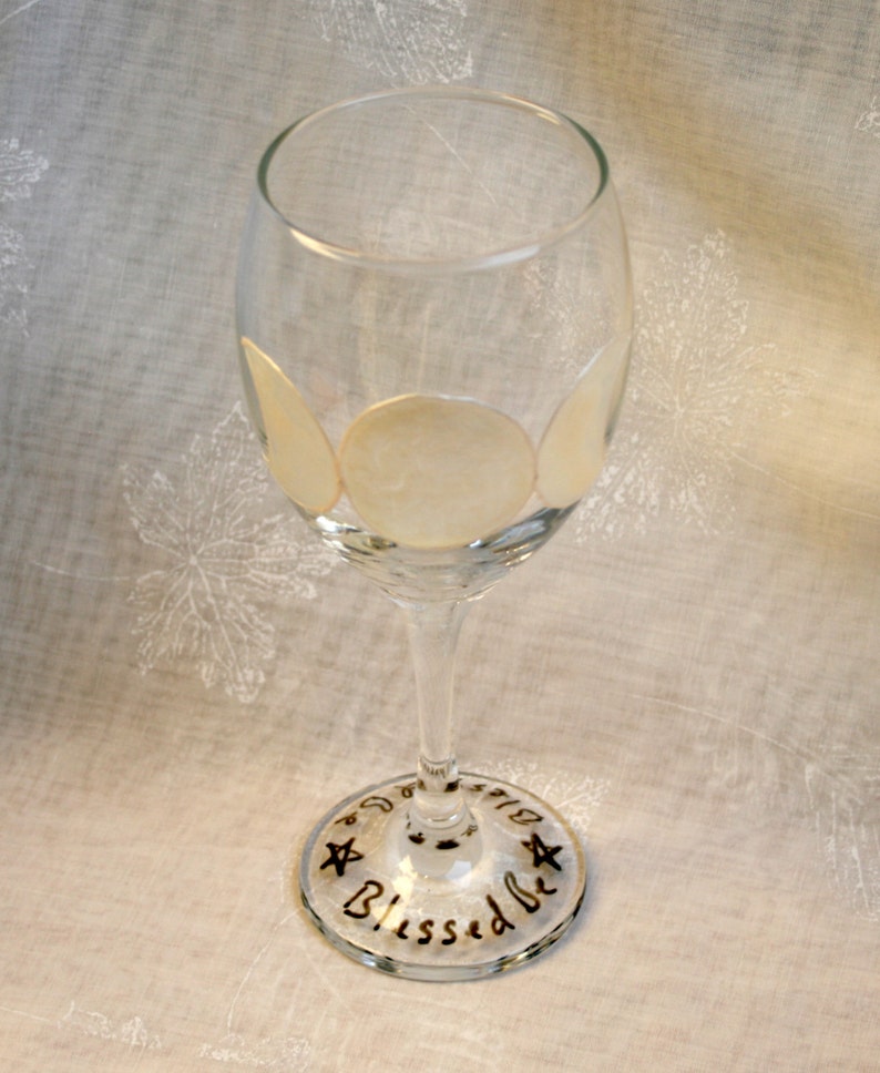 Triple Goddess. Hand painted, wine glass featuring the three phases of the moon & around the base the words 'Blessed be' and pentacles. image 3