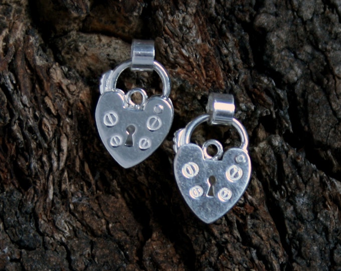 Discrete Unisex Slave Padlock stud Earrings. Padlock BDSM earring. Sterling silver. Heart shape small padlock. Buy singly or by the pair.