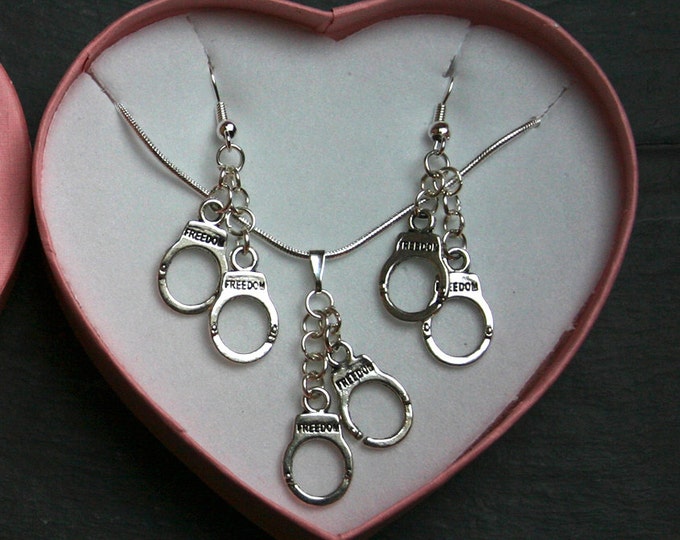 Kinky Love Cuffs Pendant & Earrings set, BOXED ~ Tibetan silver handcuffs, silver plated chain, bail and fish hook ear wires. Pink heart box