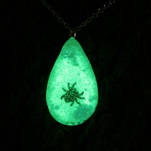 Fused glass and sterling silver &#39;Baby spider&#39; Pendant. Copper spider fused into Glow in the Dark glass. Green glow!