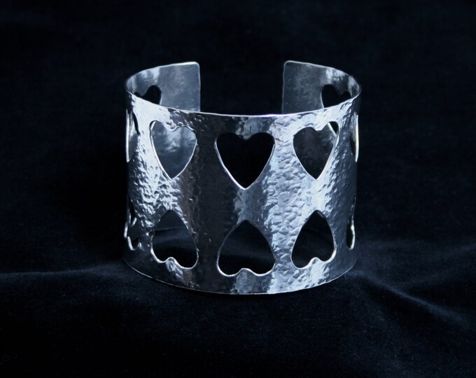 Wide cuff bracelet. 'Amore ~ Lacuna' Traditionally hand made with hammered finish for added sparkle. Fully UK Hallmarked Sterling Silver.