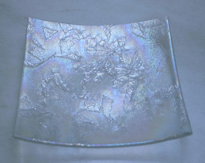 Antarctica - Square. A hand made fused glass decorative plate / trinket dish with a textured shimmering iridescent finish on a clear base.