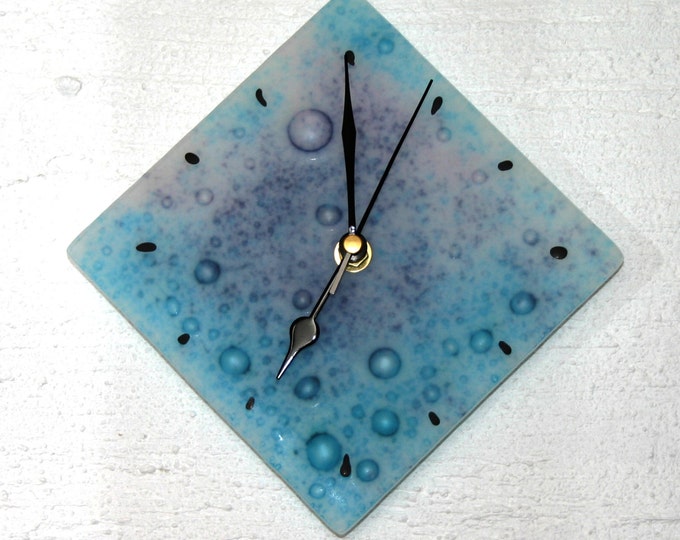 Ocean ~ A fused glass wall clock of turquoise & purple bubble glass that has been etched to resemble beach glass. Approx. 20 x 20cm (8 x 8")