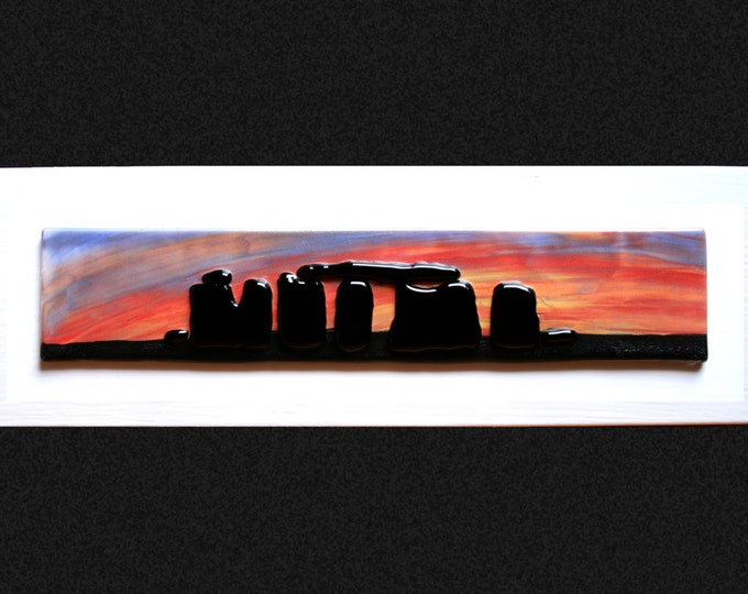 Stonehenge Sunset #2 Fused glass 'painting' raised 'stones' on a hand painted sunset background, set on a white frame. 34 x 10cm (13.5 x 4")