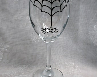 Incy Wincy Spider - An exclusive design, hand painted, happy, drunken spider hanging from his web!  On a wine glass.