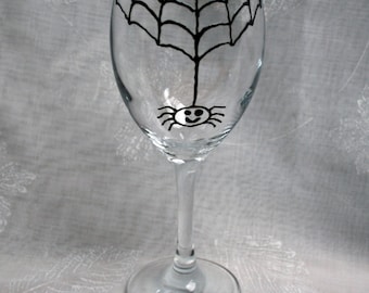 Incy Wincy Spider - An exclusive design, hand painted, happy, drunken spider hanging from his web!  On a wine glass.