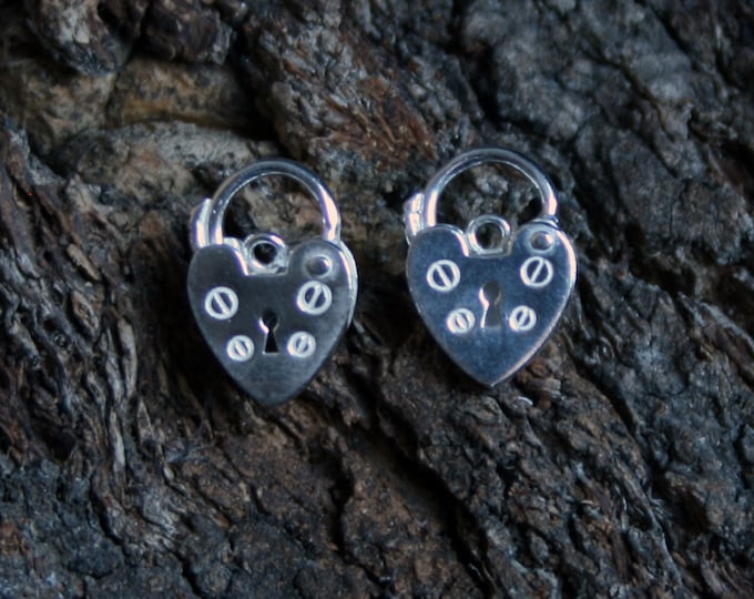 Discrete Unisex Slave Padlock stud Earrings. Padlock BDSM earring. Sterling silver. Heart shape small padlock. Buy singly or by the pair.