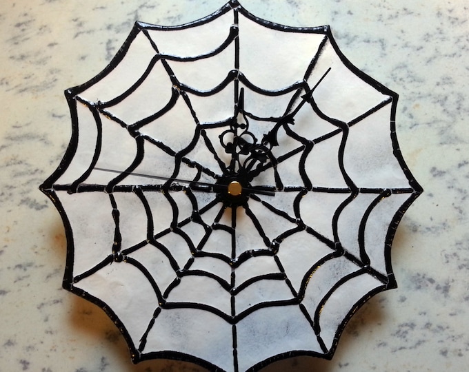 Gothic 'Wicked Webs'  wall clock - Spiderweb / Cobweb design, featuring a black web set upon a base of 3mm glass with a mottled white finish