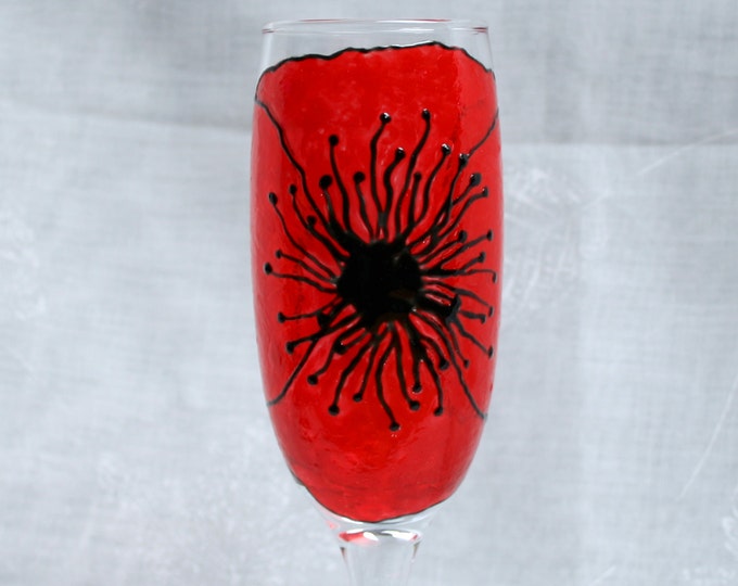 Corn Poppy - An exclusive design, hand painted, large red poppy flower on a Champagne glass.