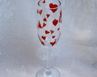 Love Heart - Red and Gold - An exclusive design, hand painted, champagne glass featuring a multitude of red hearts outlined in gold.