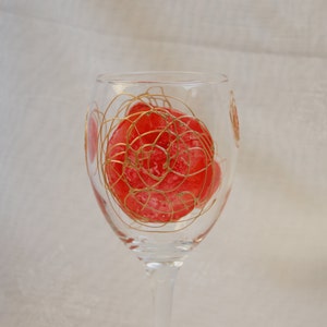 Galaxy - Red and Gold - An exclusive design, hand painted, wine glass featuring red  &#39;planets&#39; swirled with raised gold &#39;orbit trails&#39;