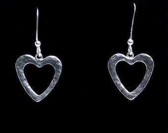 Handmade 'Amore - Lacuna' Heart earrings. Traditionally hand made, sterling silver heart drop earrings. Fish hook ear wires for pierced ears