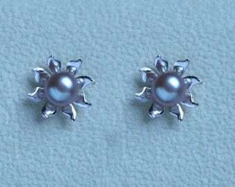 Handmade 'Ma Petite Fleur' earrings. Traditionally hand made sterling silver flower stud earrings with Pink pearls, for pierced ears