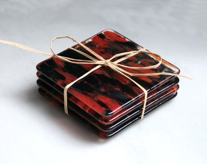 Fused glass coasters. 'Vampire Dreams - Clarity' A set of 4 sturdy coasters, made in stunning 'splashes' of reds and black on a clear base.