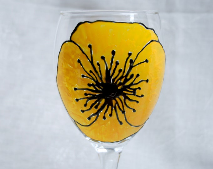 Welsh Poppy - An exclusive design, hand painted, large yellow poppy flower on a wine glass.