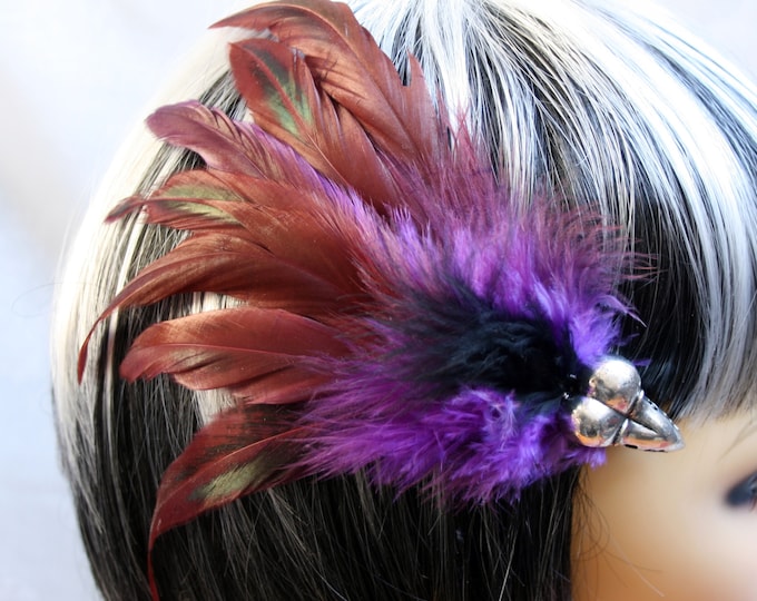 Exclusive 'Purple plus Raven' hair grip / fascinator in Purple and pinky red, with hints of green and a center of black.