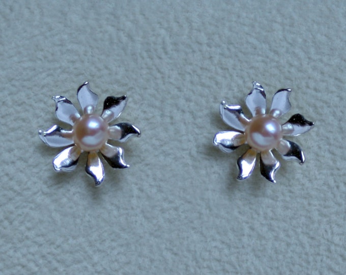 Handmade 'Ma Petite Fleur' earrings. Traditionally hand made sterling silver flower stud earrings with peach pearls, for pierced ears