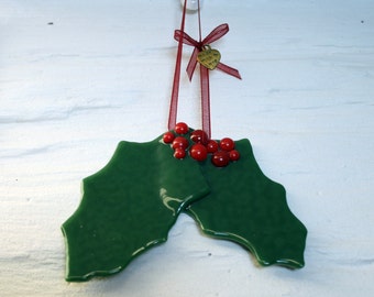 Hanging Holly - Fused glass Festive hanging Yuletide Christmas tree/ window/ wall ornament. Festive holly leaves adorned with red berries.