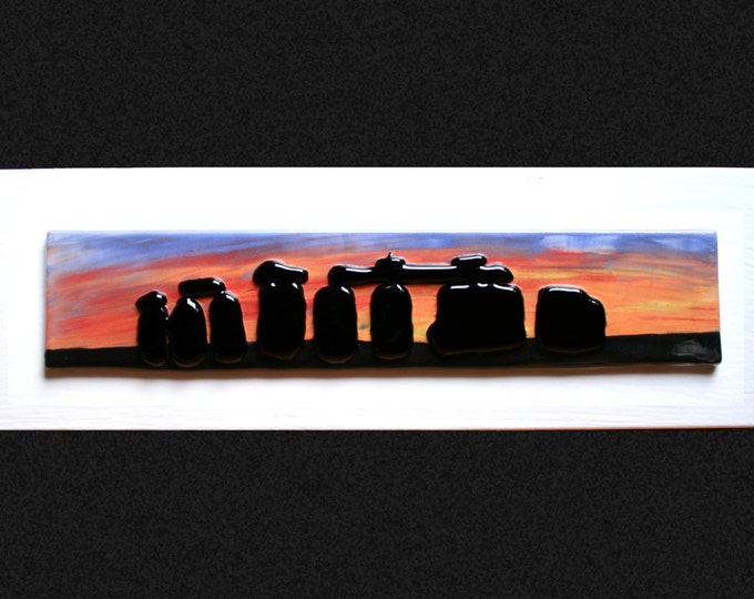 Stonehenge Sunset #4 Fused glass 'painting' raised 'stones' on a hand painted sunset background, set on a white frame. 34 x 10cm (13.5 x 4")