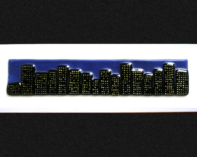 Fused glass painting 'Midnight city'.  Cityscape on a hand painted night sky background, set on a white frame. 34 x 10cm (13.5 x 4")