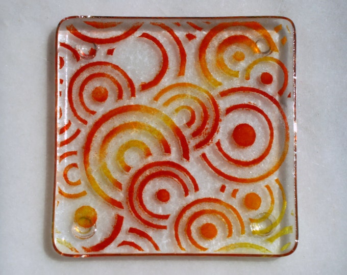 Fused glass coasters. 'Círculos de sol'  Flame red, orange and yellow circles on a clear base. Geometric coasters. Choose 2 or 4.