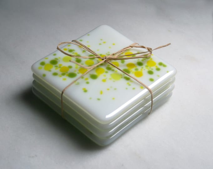 Handmade fused art glass coasters. 'Cosmos - Zesty'  Vibrant yellow and green on a white base. Choose a pair or a set of 4.