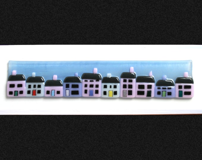 Fused glass painting 'The Promenade' A row of pastel cottages, set against a hand painted blue summer sky on a white frame 34x10cm (13.5x4")