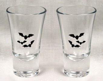 Bat Shot in Black - Pair of hand enameled shot glasses featuring a trio of beautiful black bats. Dishwasher safe!