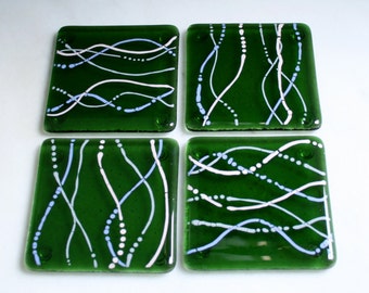 Fused glass coasters. 'Serpentine - Enchantment'  Pale pink, Lavender & Grey on a bottle green base. Squiggly coasters. Choose 2 or 4.
