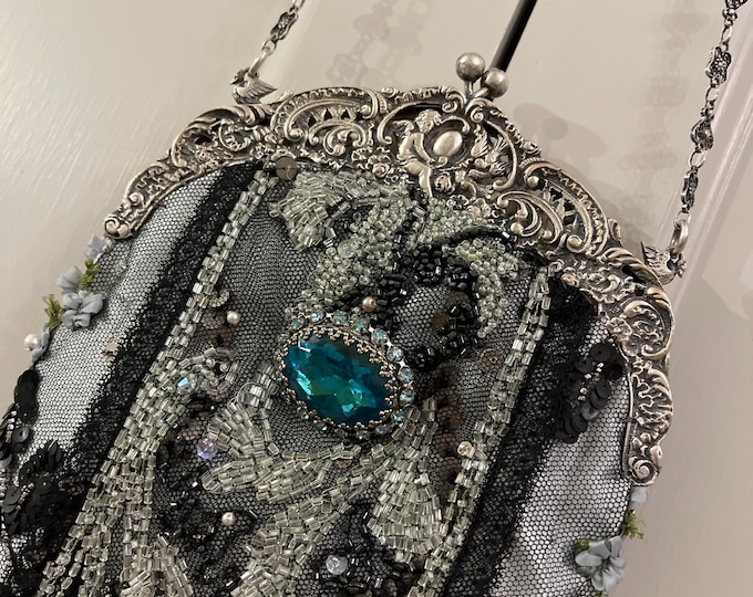 Antique  silver (800) hallmarked purse frame remade in vintage beaded lace over Aqua silk.