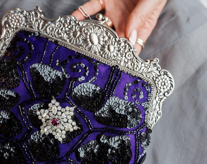 Antique  silver  marked Alpaca purse frame remade in vintage beaded lace over purple silk.