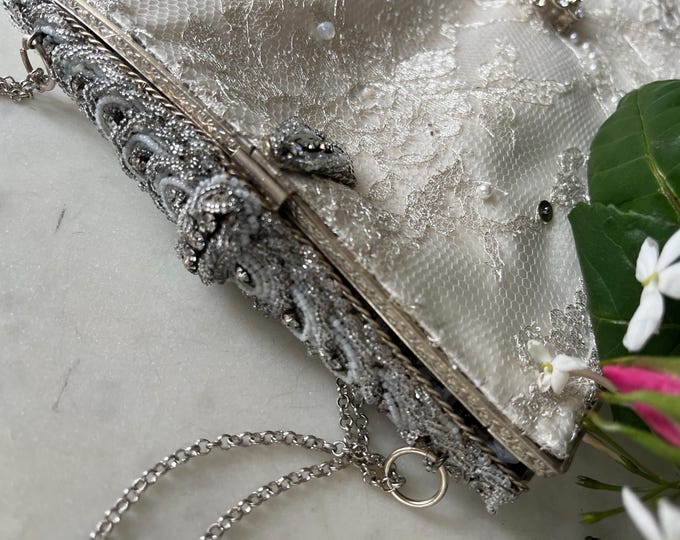 Antique  micro beaded purse frame remade in silver beaded lace over white silk.
