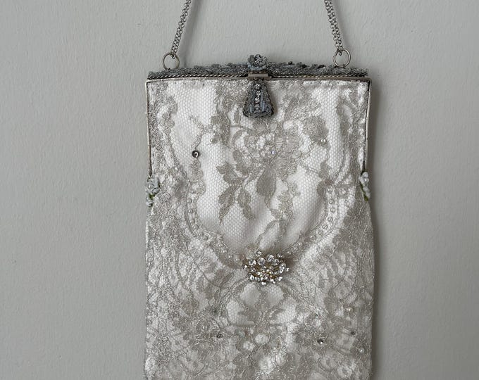 Antique  micro beaded purse frame remade in silver beaded lace over white silk.