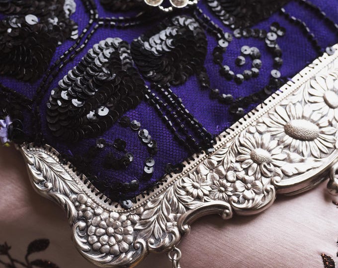 Antique  silver  marked Alpaca purse frame remade in vintage beaded lace over purple silk.
