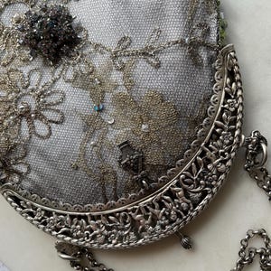Antique  silver  hallmarked purse frame remade in vintage beaded lace over Silver silk.