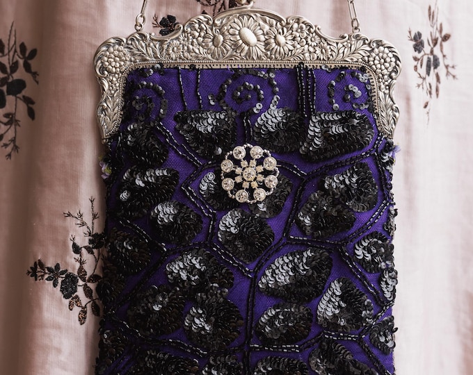 Antique  silver  marked Alpaca purse frame remade in vintage beaded lace over purple silk.