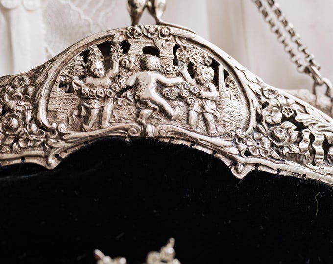 Antique  silver hall  marked 800 purse frame remade in black silk velvet.