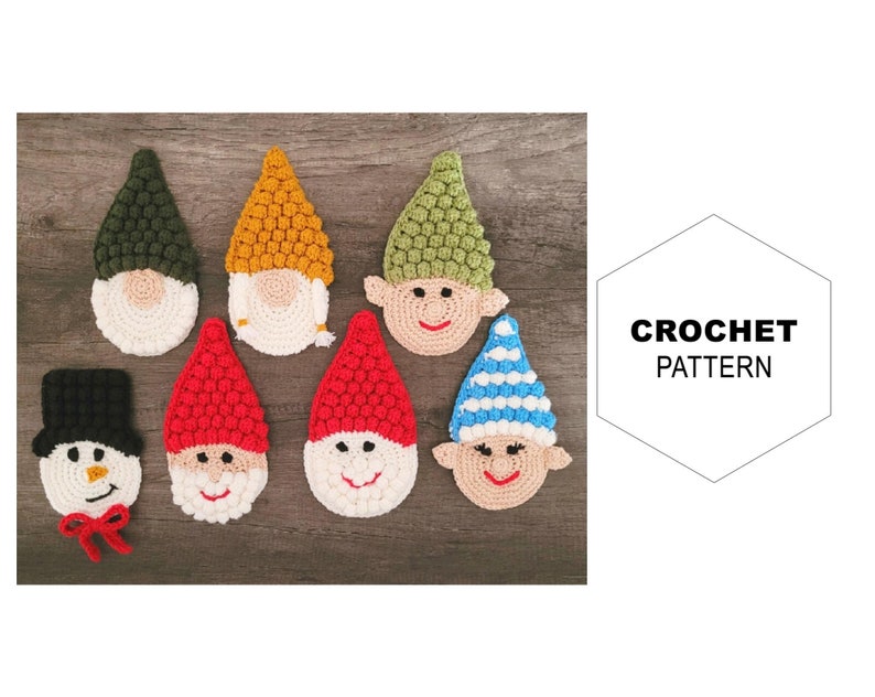 May include: A collection of handmade crochet gnome and snowman face coasters in various colors. The gnomes have green, yellow, and red hats, white beards, and smiling faces. The snowman has a black hat and a red bow. The text "CROCHET PATTERN" is also visible.