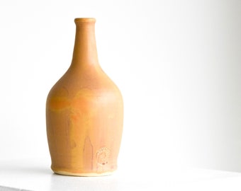 Ceramic bottle or jar, hand thrown, in a honey gold glaze