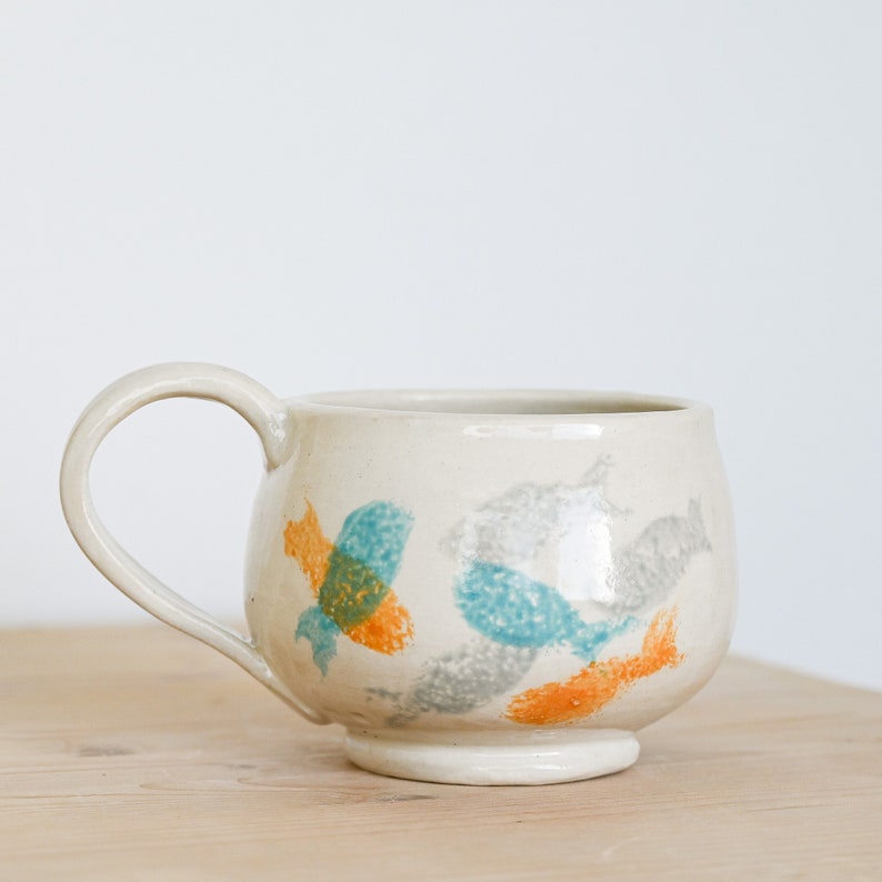 Ceramic mug, large, handmade in stoneware, painted with a fish motif in dove gray, teal and tangerine. image 1