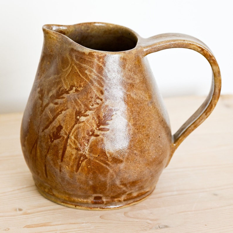 Ceramic pitcher, hand-thrown in stoneware, golden brown with hand-painted wheat motif on two sides. image 2