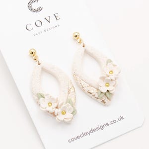 Handmade White Flower Dangle Polymer Clay Earrings for Women by Cove. White Wedding Floral Earrings.