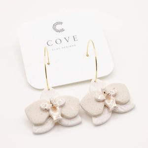 Handmade White Orchid Hoop Earrings by COVE. Orchid Flower Polymer Clay Earrings for Women.