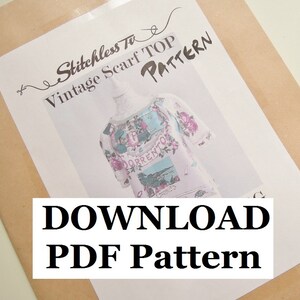 May include: A white paper with the text "Stitchless To Vintage Scarf Top Pattern" and "DOWNLOAD PDF Pattern" in black text. The image shows a white top with a floral print on a mannequin.