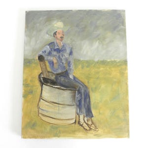 May include: An oil painting on canvas depicting a figure wearing a light-colored hat, a blue shirt, and blue trousers, sitting on a large cylindrical container. The background features a yellow field under a grey, cloudy sky with visible brushstrokes.