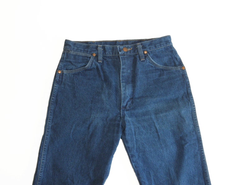 May include: A pair of blue denim jeans with a high waist and a classic straight leg fit.