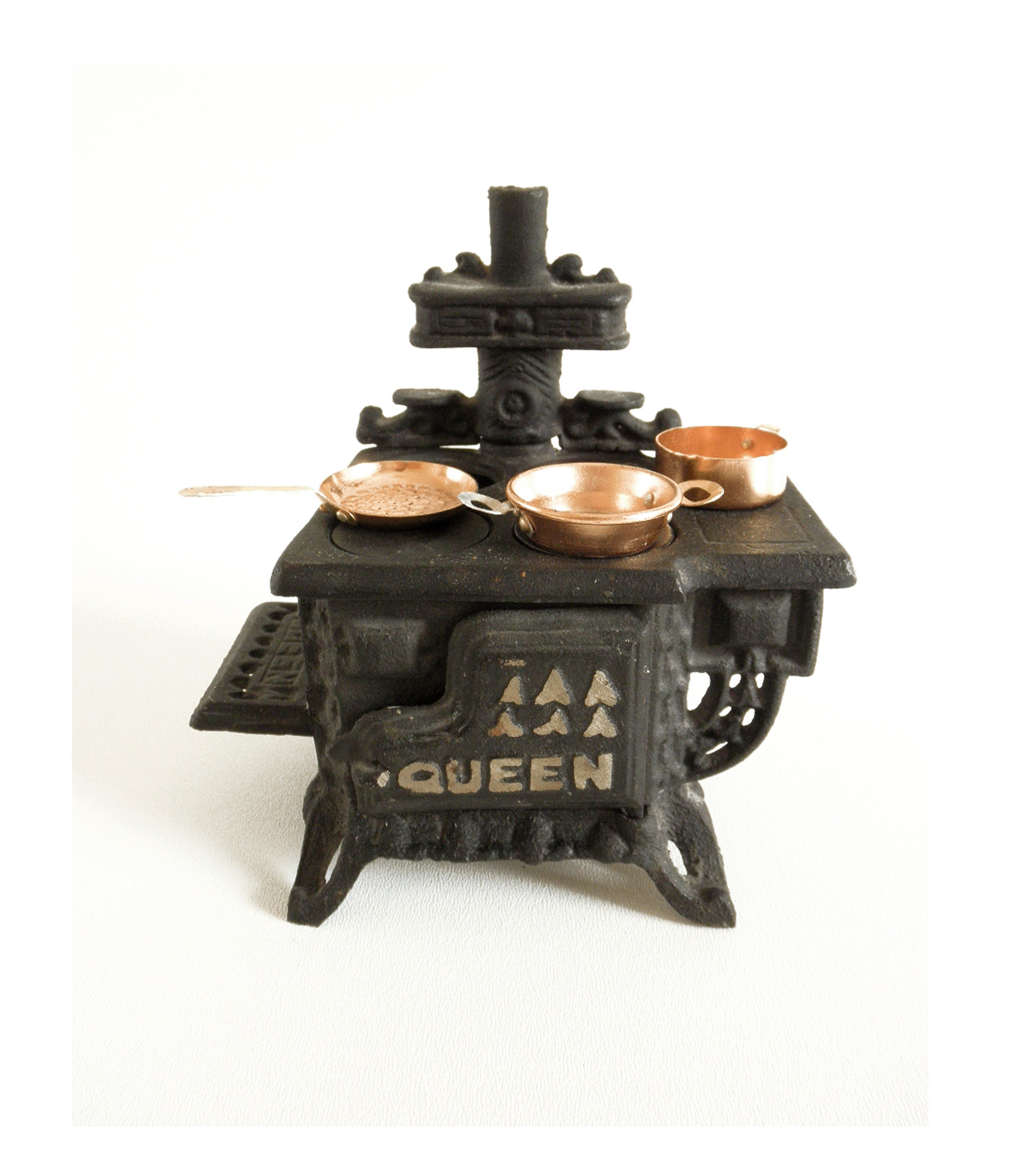 Sold at Auction: Two Miniature Cast Iron Stoves and Pans